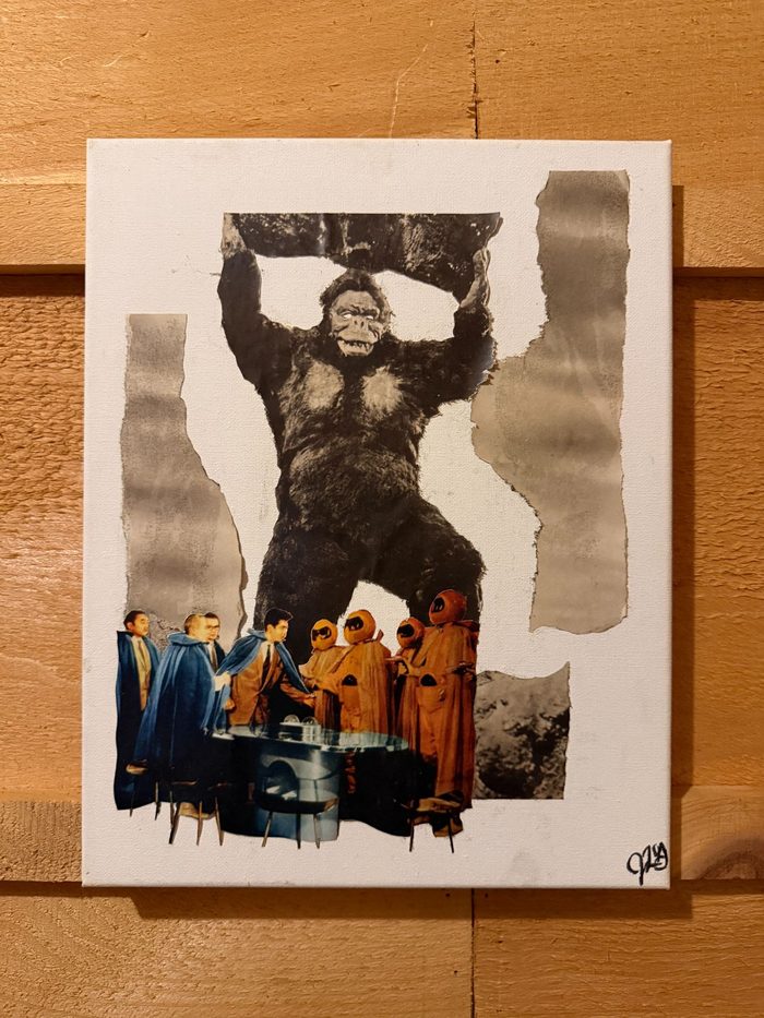 Collage of King Kong above a boardroom